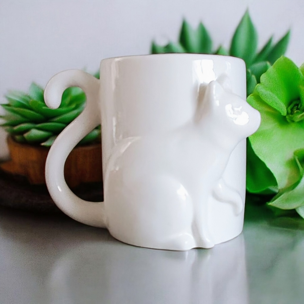 White Ceramic Mug With A Cat Design Cat's Tail Is The Handle From INDIGO.